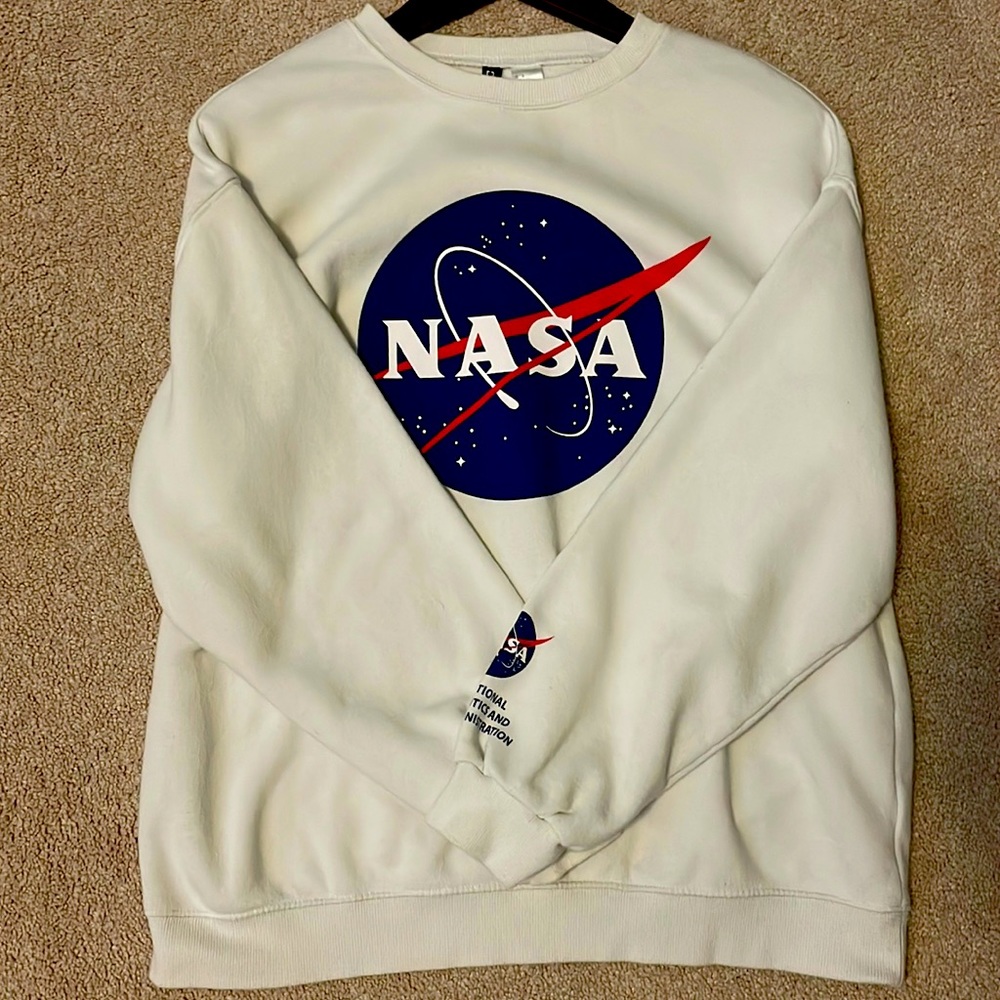 A white Divided NASA hoodie.